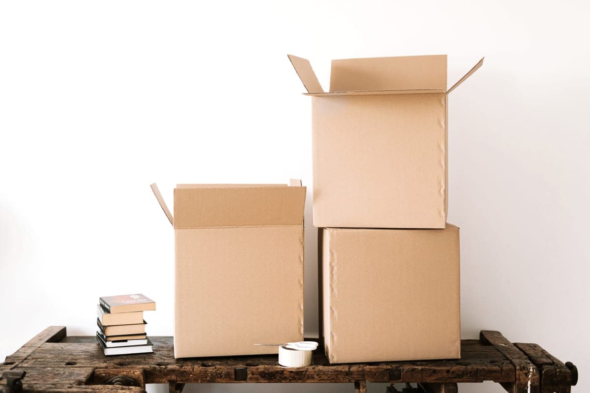 Cardboard moving boxes stacked by an apartment doorway
